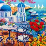 Tre vele all'orizzonte e luce a Santorini