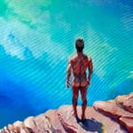 Nude man on cliff